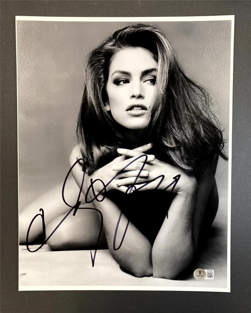 11x14 Photograph Signed by Cindy Crawford with Beckett Authentication: 11x14 Photograph Signed by Cindy Crawford with Beckett Authentication This 11x14 photograph features the autograph of actress and model Cindy Crawford. The signature has been authenticated by Beckett,