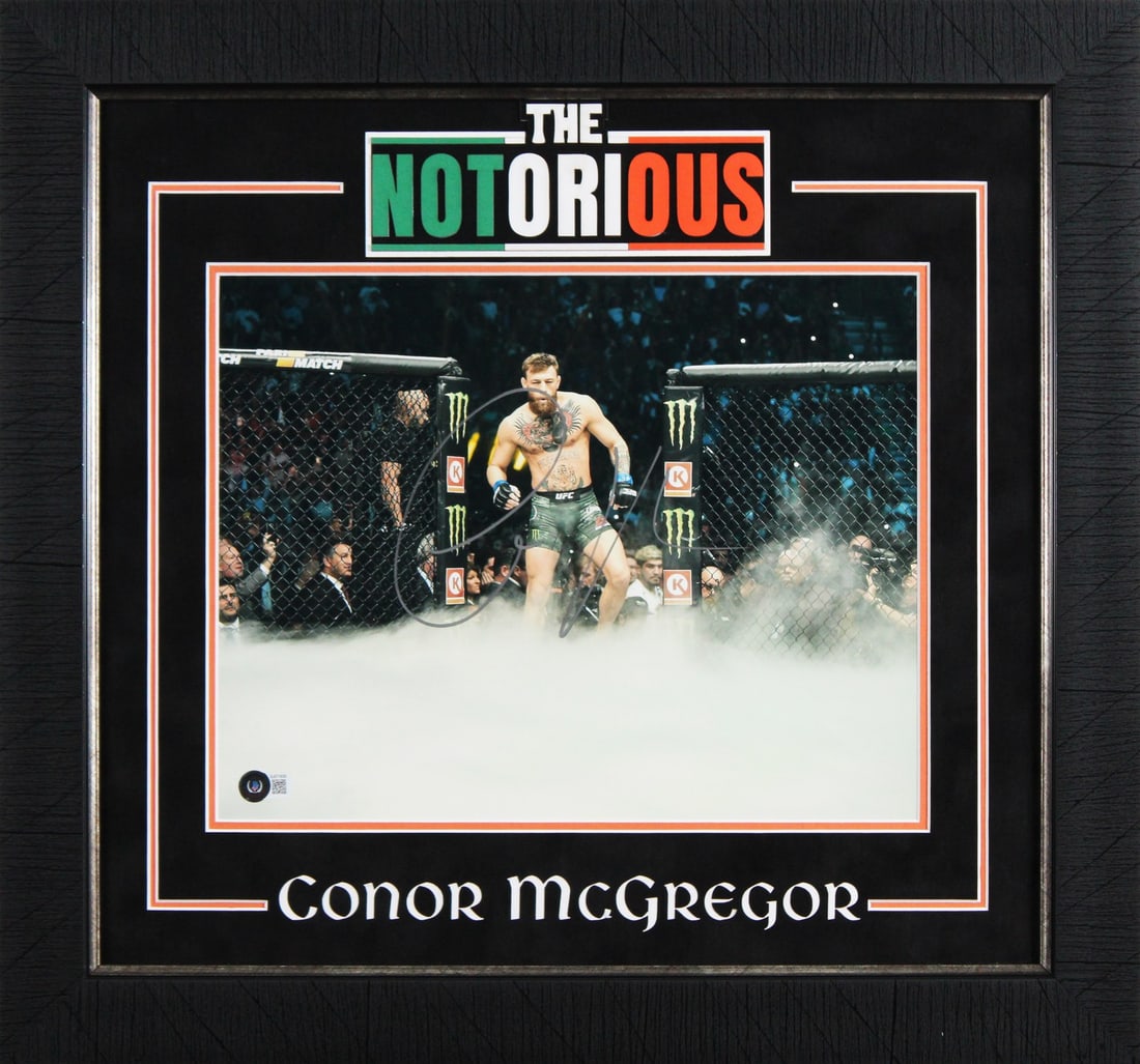 Conor McGregor autographed 11x14 framed UFC photo Beckett BAS BJ071839: Conor McGregor autographed 11x14 framed UFC photo Beckett BAS BJ071839 Authentic signed and framed 11x14 photo of Conor McGregor. This original autographed piece is authenticated by Beckett Authentica