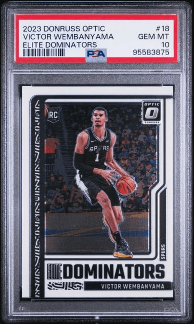 PSA 10 Victor Wembanyama 2023 Donruss Optic Elite Dominators #18 Rookie Card: PSA 10 Victor Wembanyama 2023 Donruss Optic Elite Dominators #18 Rookie Card Graded 2023 Donruss Optic Victor Wembanyama #18 Elite Dominators rookie card. This multicolor sports trading card features 
