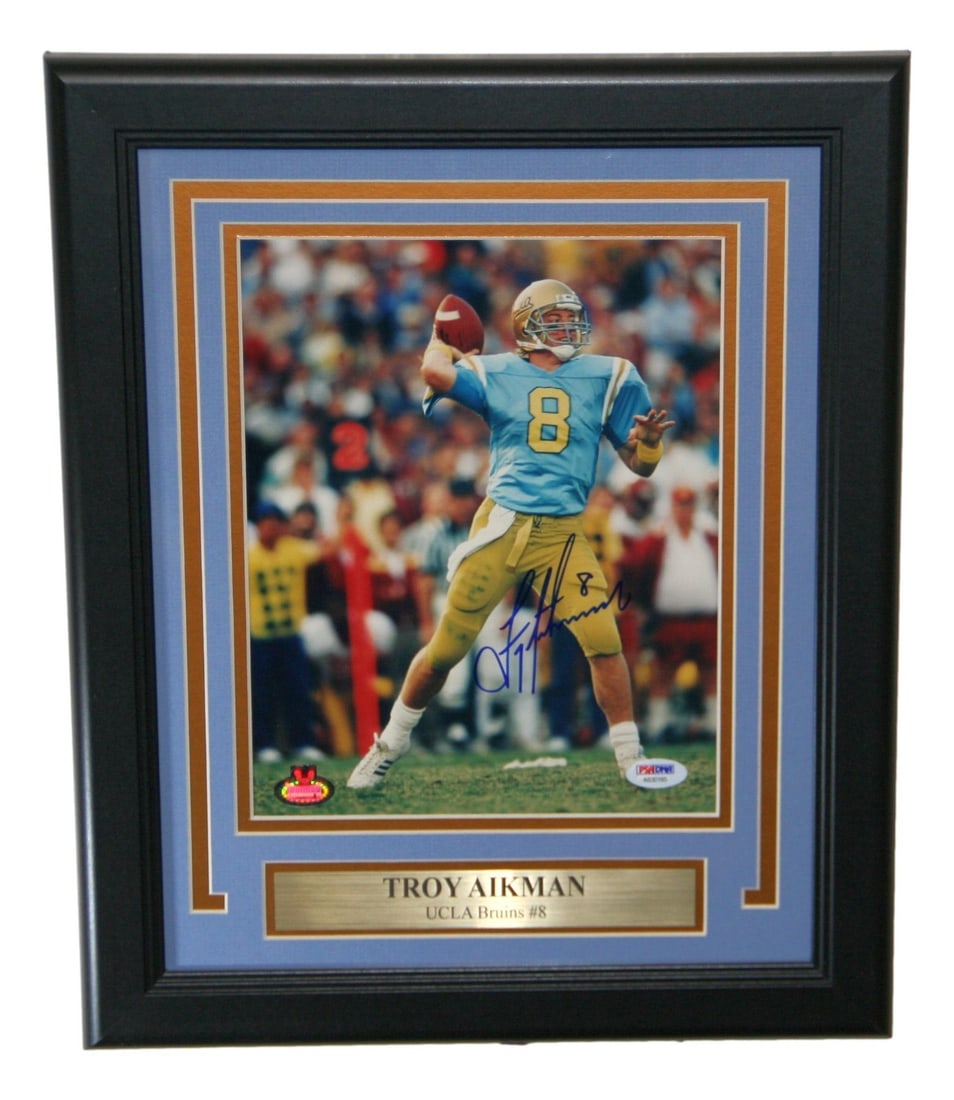Troy Aikman Signed Framed 8x10 UCLA Bruins Photo PSA/DNA: Troy Aikman Signed Framed 8x10 UCLA Bruins Photo PSA/DNA This stunning framed photo captures Troy Aikman during his time with the UCLA Bruins, making it a must-have for any football enthusiast. The 8x