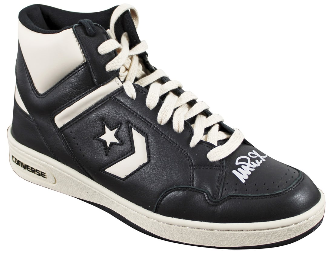 Magic Johnson Signed Converse Weapon Right Shoe Beckett Witnessed: Magic Johnson Signed Converse Weapon Right Shoe Beckett Witnessed Autographed right black and white Converse Weapon shoe personally signed by Magic Johnson of the Los Angeles Lakers. This original sig