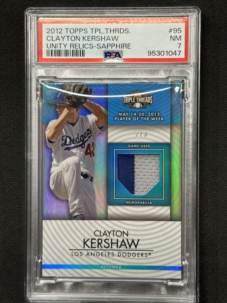 Clayton Kershaw 2012 Topps Triple Thread Sapphire Relic PSA 7 #95: Clayton Kershaw 2012 Topps Triple Thread Sapphire Relic PSA 7 #95 This is a 2012 Topps Triple Thread Sapphire Unity Relic baseball card featuring Clayton Kershaw, a prominent player for the Los Angele