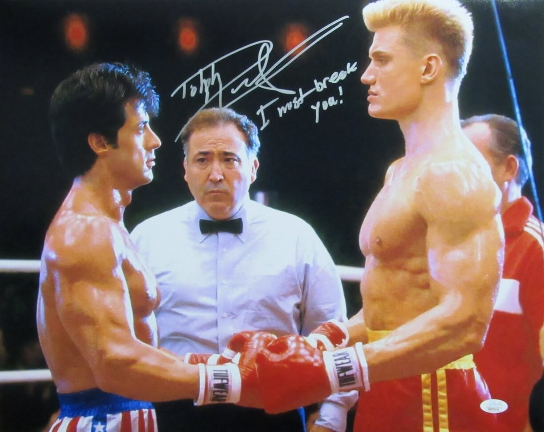 Dolph Lundgren Autographed 16x20 Photo Balboa vs Drago JSA Certified: Dolph Lundgren Autographed 16x20 Photo Balboa vs Drago JSA Certified This offering features a Dolph Lundgren autographed and inscribed 16x20 photo capturing the iconic "Balboa vs Drago" moment. The in
