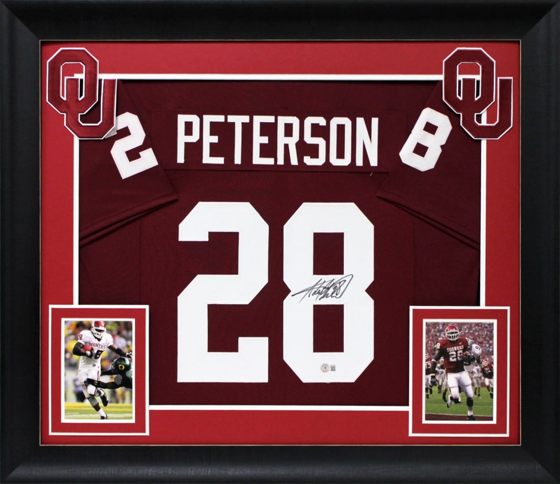 Adrian Peterson Signed Oklahoma Sooners Maroon Framed Jersey with BAS Authentication: Adrian Peterson Signed Oklahoma Sooners Maroon Framed Jersey with BAS Authentication Celebrate the legacy of football with this authentic, signed maroon pro style framed jersey of Adrian Peterson, the