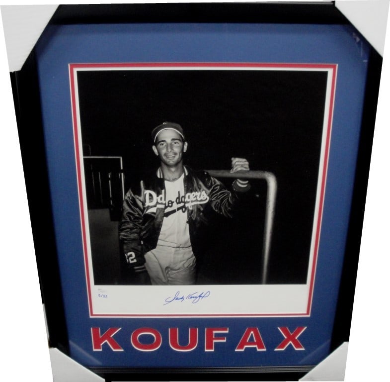 Sandy Koufax Autographed 16X20 Framed Photo JSA Authenticated: Sandy Koufax Autographed 16X20 Framed Photo JSA Authenticated This stunning 16x20 photograph of Sandy Koufax captures the legendary pitcher in the dugout, hand-signed and custom framed for an elegant 
