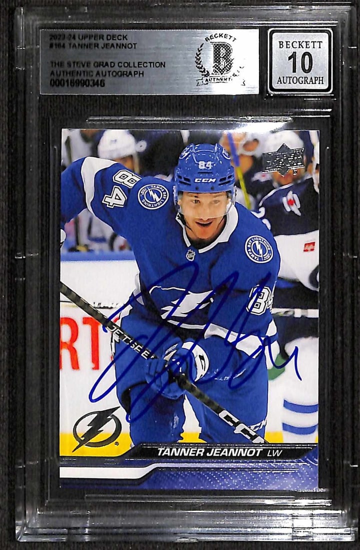 2023-24 Upper Deck Hockey Card Signed by Tanner Jeannot Beckett Auto 10: 2023-24 Upper Deck Hockey Card Signed by Tanner Jeannot Beckett Auto 10 This is an original 2023/24 Upper Deck sports trading card autographed by Tanner Jeannot of the Tampa Bay Lightning. The card fe