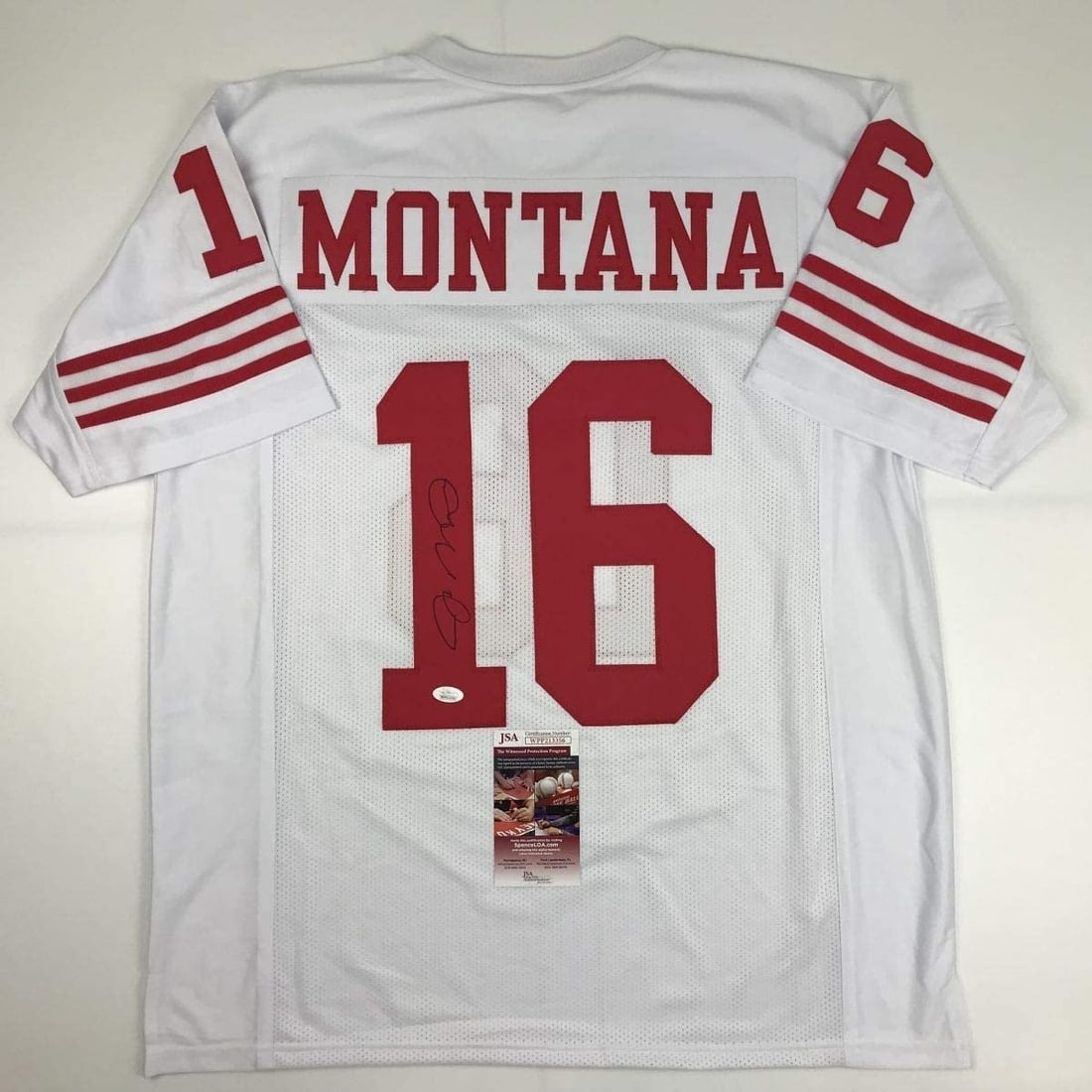 Joe Montana Signed White Football Jersey JSA Certified San Francisco 49ers: Joe Montana Signed White Football Jersey JSA Certified San Francisco 49ers Autographed Joe Montana white football jersey with JSA authentication. This pre-owned custom jersey is intended as an autogra