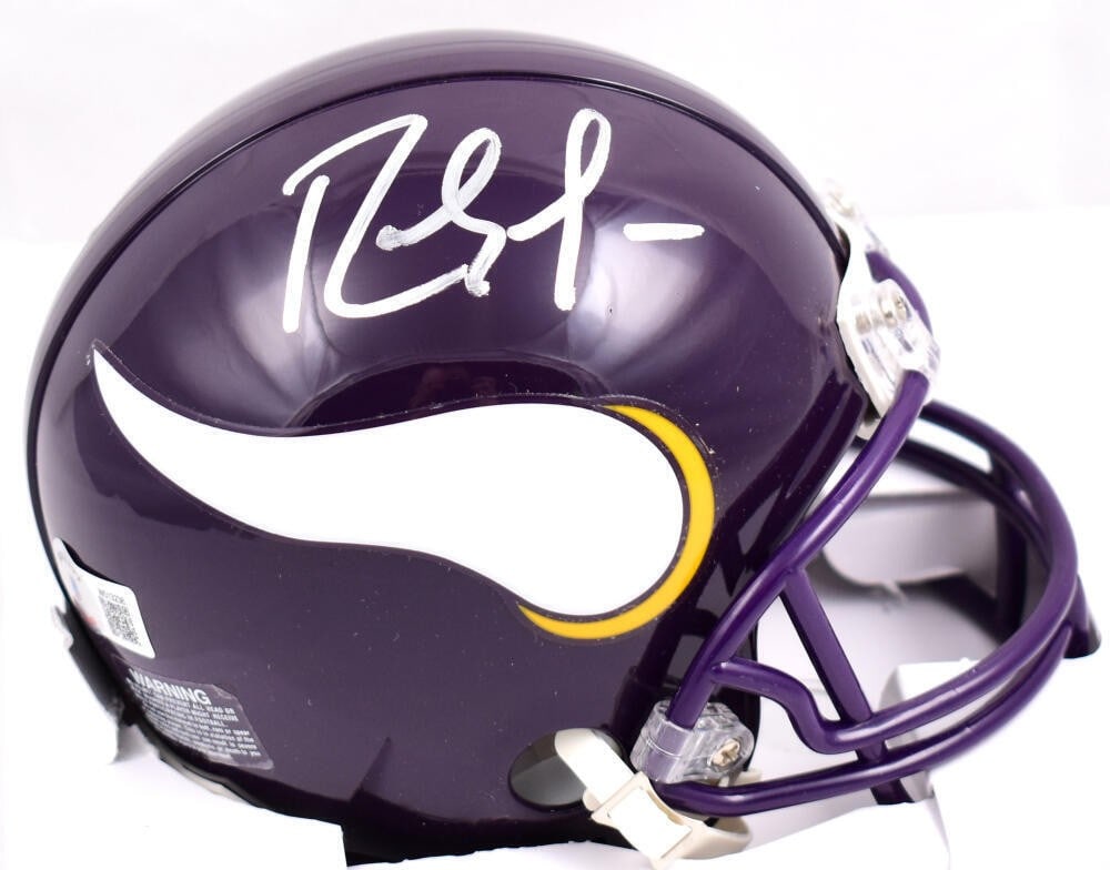 Randy Moss Signed Minnesota Vikings Mini Helmet Beckett Authenticated: Randy Moss Signed Minnesota Vikings Mini Helmet Beckett Authenticated This mini helmet features the iconic signature of Randy Moss, a legendary player of the Minnesota Vikings. The item is an original