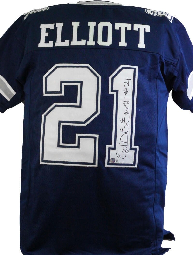 Ezekiel Elliott signed Dallas Cowboys blue pro style jersey Beckett hologram: Ezekiel Elliott signed Dallas Cowboys blue pro style jersey Beckett hologram This blue pro style jersey features the autograph of Ezekiel Elliott and represents the Dallas Cowboys. The signature has b