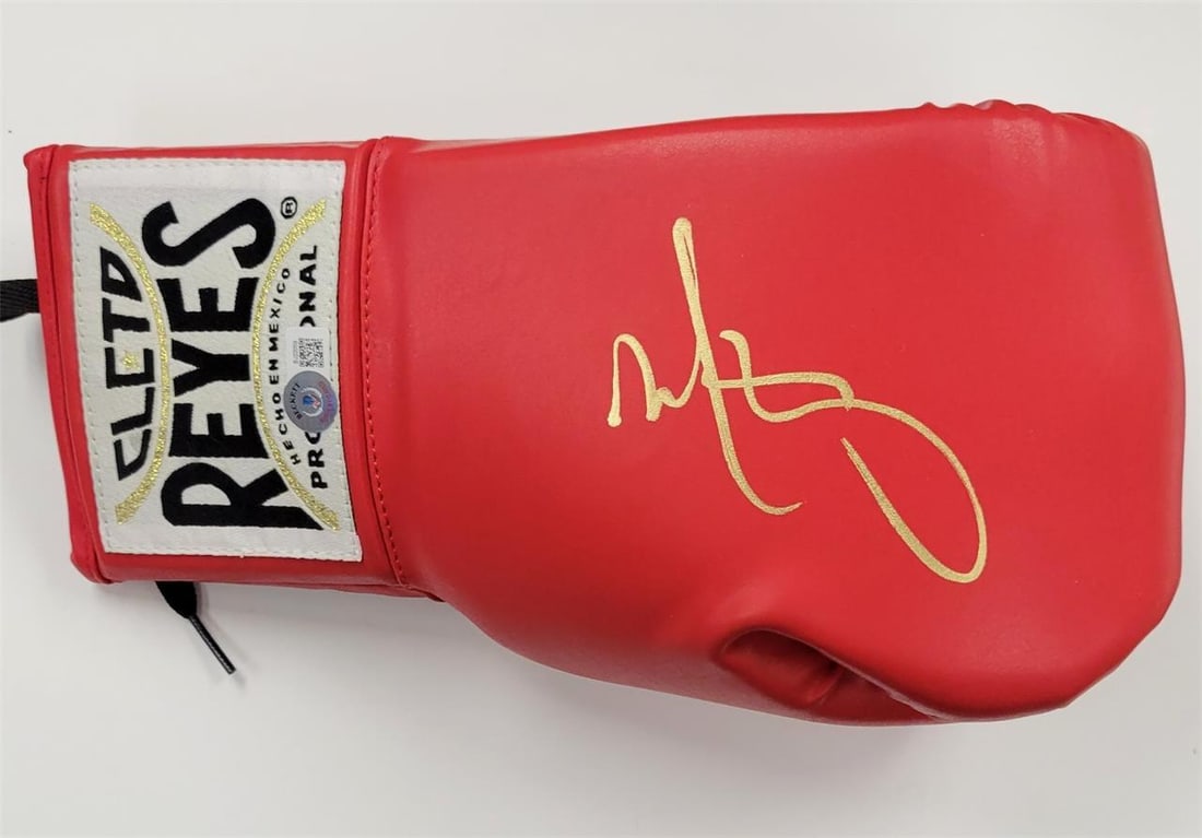 Boxing Glove Signed by Mark Wahlberg The Fighter Beckett Authenticated: Boxing Glove Signed by Mark Wahlberg The Fighter Beckett Authenticated This is an original boxing glove signed by Mark Wahlberg, featuring a gold autograph from his role in the movie 'The Fighter.' Th