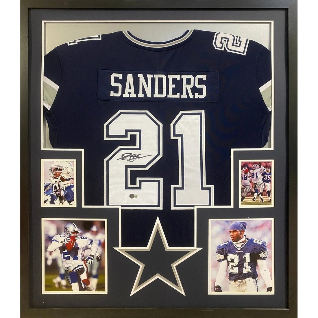 Deion Sanders Signed Framed Cowboys Jersey Beckett Authenticated: Deion Sanders Signed Framed Cowboys Jersey Beckett Authenticated This autographed Deion Sanders framed jersey is a striking piece for any sports memorabilia collector. Authenticated by Beckett, a lead