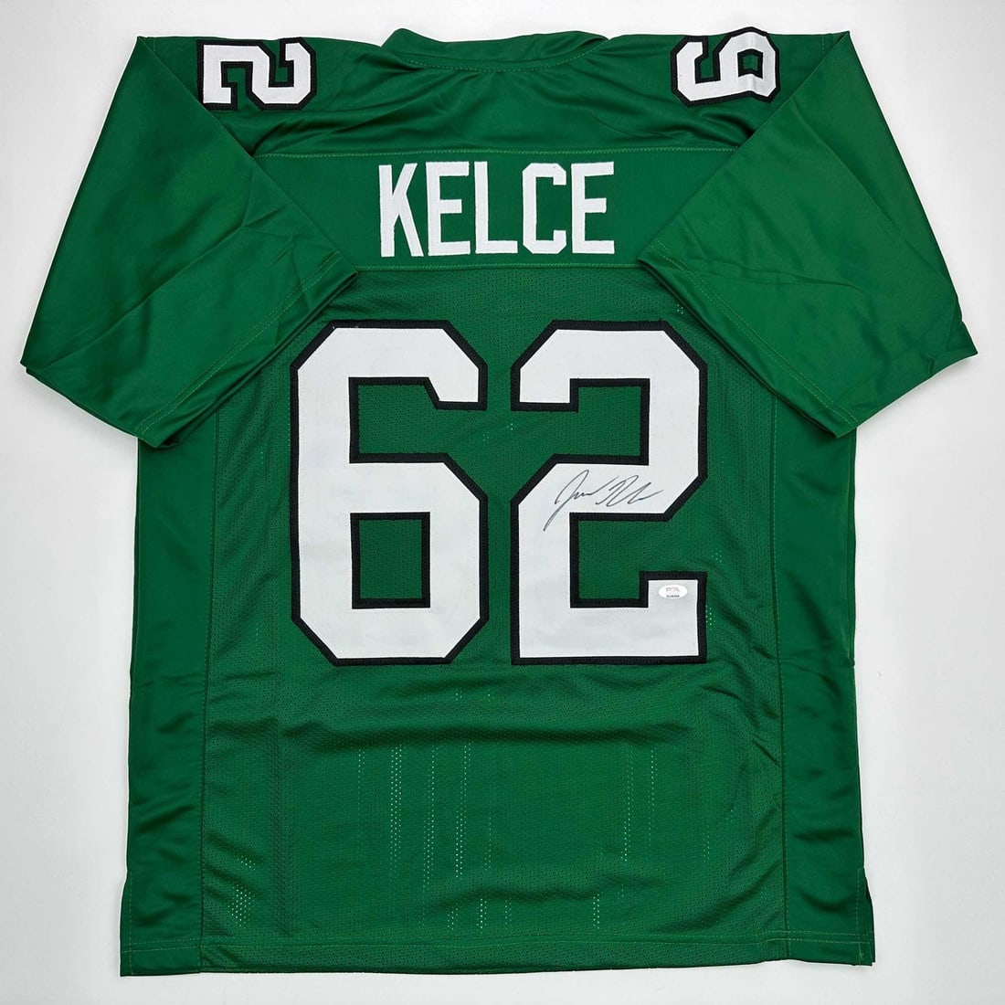 Jason Kelce Signed Eagles Kelly Green Custom Jersey PSA DNA: Jason Kelce Signed Eagles Kelly Green Custom Jersey PSA DNA Autographed Jason Kelce Philadelphia Kelly green custom jersey intended as a collectible display piece. The jersey features the player's nam