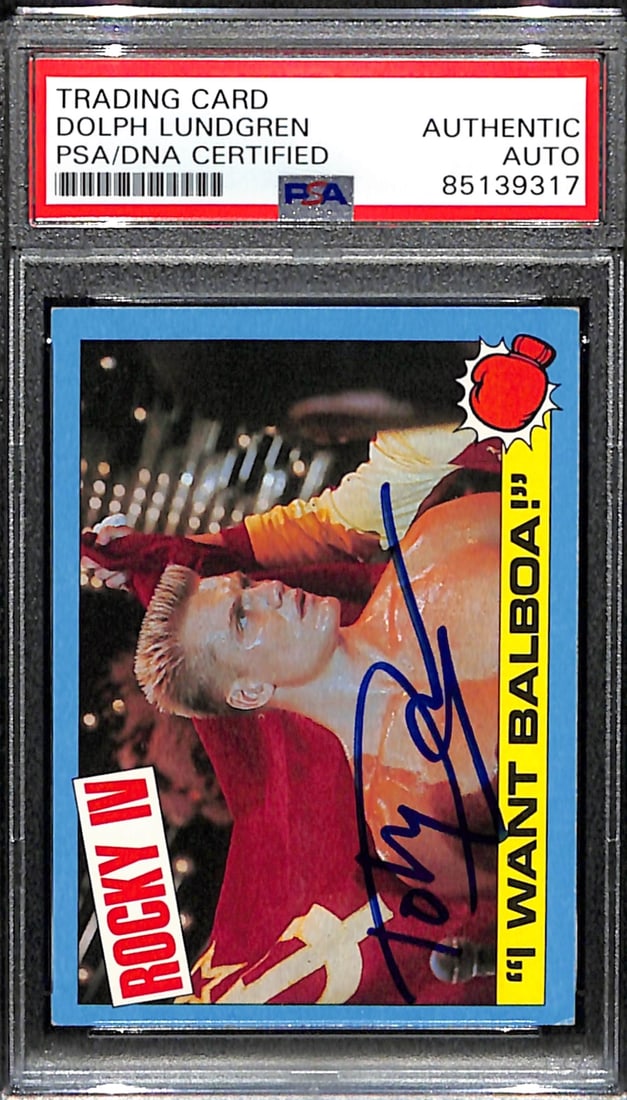Dolph Lundgren Signed 1985 TOPPS Rocky IV Drago Card PSA/DNA #25: Dolph Lundgren Signed 1985 TOPPS Rocky IV Drago Card PSA/DNA #25 This offering features a Dolph Lundgren signed 1985 TOPPS Rocky IV Drago trading card, numbered #25, showcasing the iconic moment "I Wa