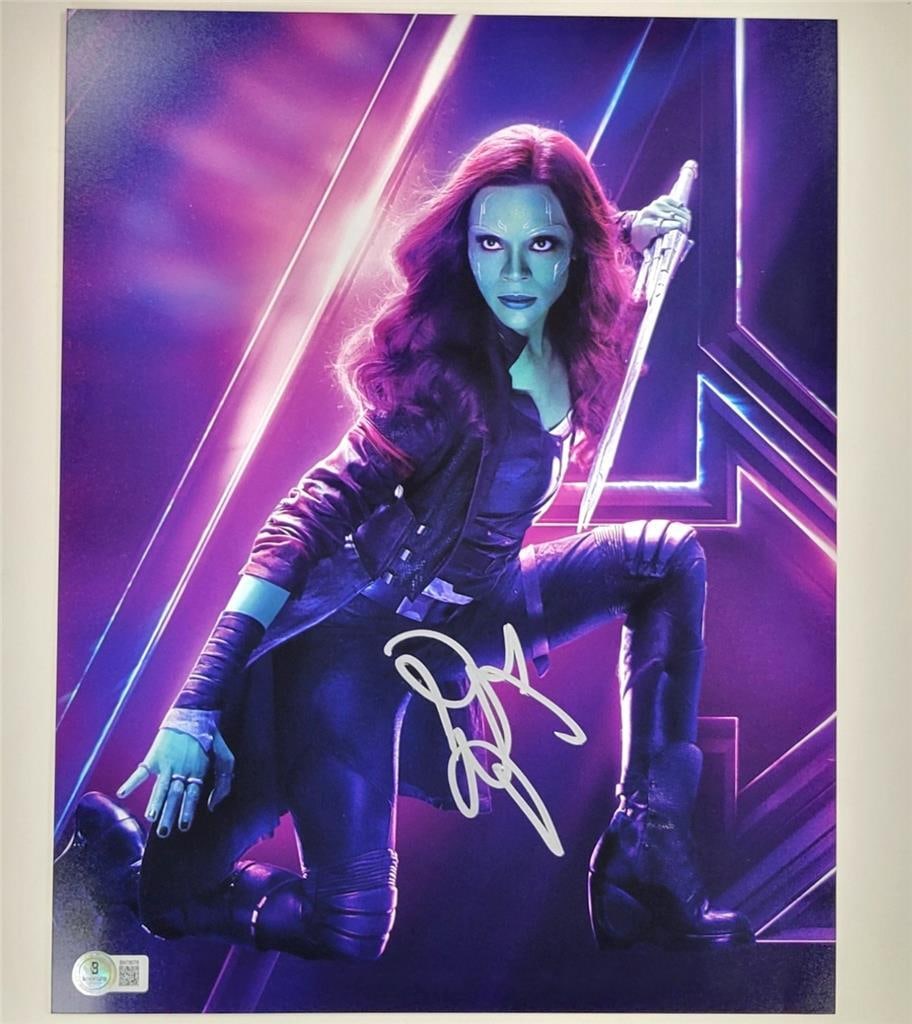 Beckett authenticated Zoe Saldana autograph as Gamora Avengers 11x14 photograph: Beckett authenticated Zoe Saldana autograph as Gamora Avengers 11x14 photograph This is an original 11x14 photograph of Gamora from the Avengers and Guardians series, signed by Zoe Saldana. The autogr