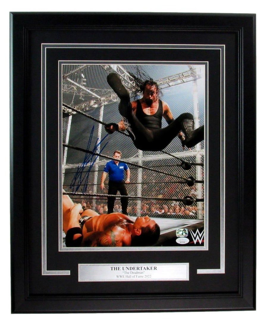 Framed Undertaker Mark Calaway Signed 11x14 Wrestling Photo JSA: Framed Undertaker Mark Calaway Signed 11x14 Wrestling Photo JSA This is an original, signed 11x14 photo of Mark William Calaway, famously known as the "Undertaker," beautifully framed. The outer dimen