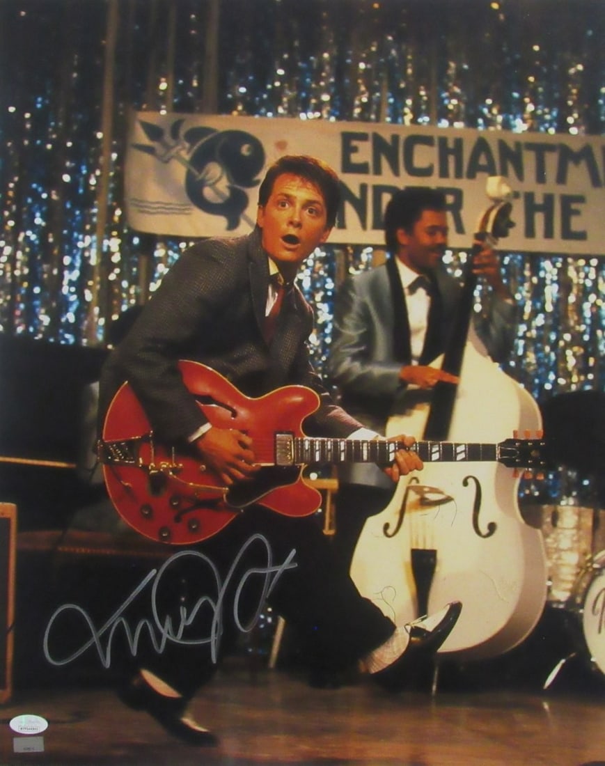 JSA authenticated 16x20 Back to the Future photo signed by Michael J Fox: JSA authenticated 16x20 Back to the Future photo signed by Michael J Fox Original 16x20 Back to the Future photo featuring Michael J. Fox as McFly with a guitar. This pre-owned photo is signed by Mich
