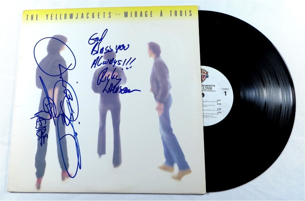 The Yellowjackets Autographed Album Cover JSA Authenticated: The Yellowjackets Autographed Album Cover JSA Authenticated This is an original autographed record album cover by the renowned jazz fusion group, The Yellowjackets. It features the signatures of band 