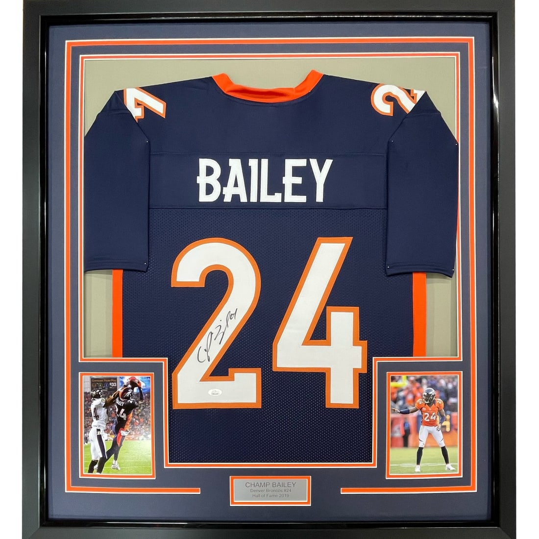 Champ Bailey Signed Broncos Blue Framed Jersey 35x39 JSA: Champ Bailey Signed Broncos Blue Framed Jersey 35x39 JSA Professionally framed and matted original Denver Broncos blue jersey signed by Champ Bailey. This pre-owned display includes two 5x7 photos and