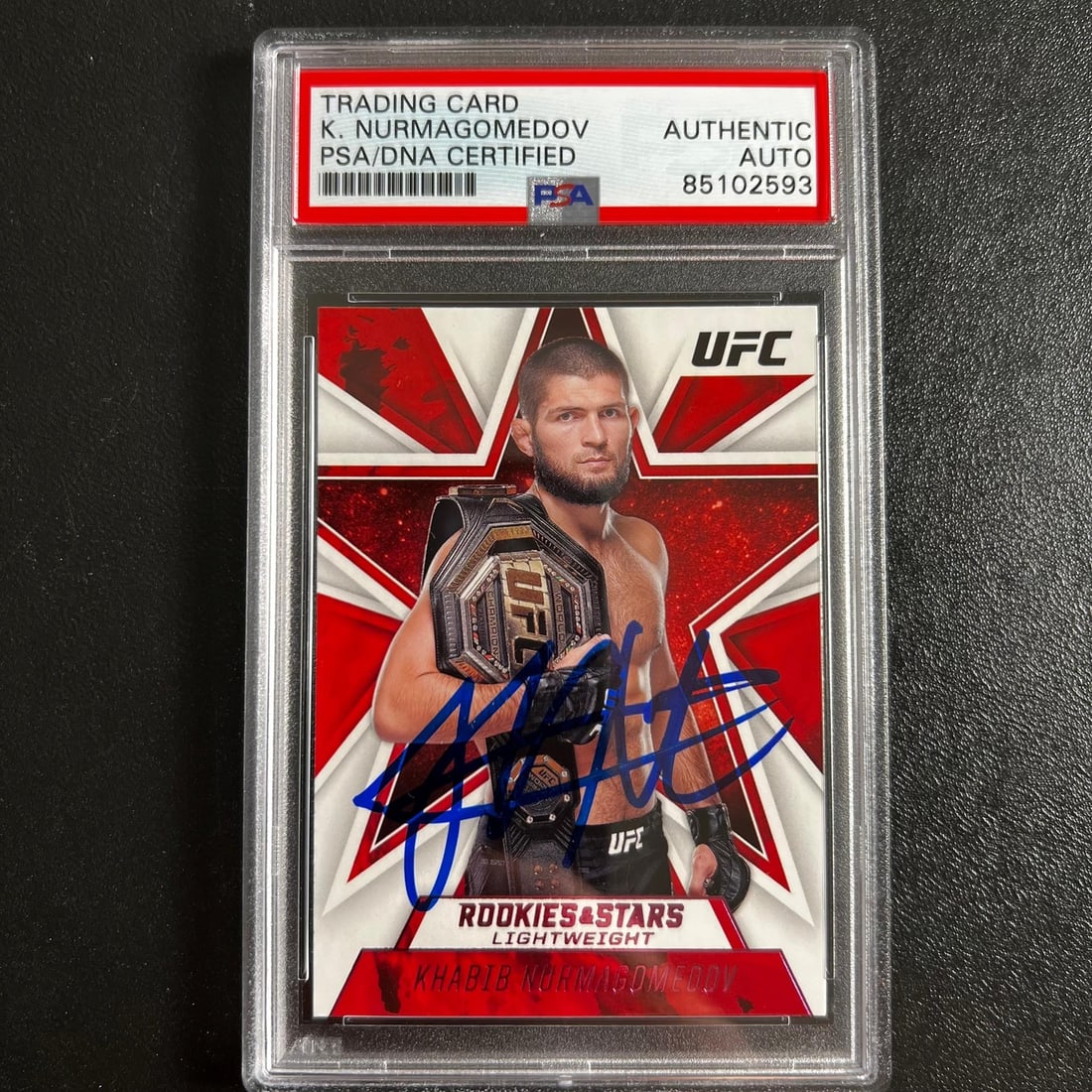 2021 Panini Chronicles Khabib Nurmagomedov Signed Card PSA Authenticated: 2021 Panini Chronicles Khabib Nurmagomedov Signed Card PSA Authenticated This is a 2021 Panini Chronicles Rookies & Stars #81 trading card featuring the legendary Khabib Nurmagomedov, a prominent figu