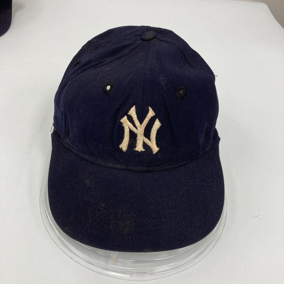 Vintage 1950s New York Yankees Game Used Cap from Miami Marlins Clubhouse: Vintage 1950s New York Yankees Game Used Cap from Miami Marlins Clubhouse This vintage 1950's New York Yankees baseball cap is a unique piece of sports memorabilia. Originally used during games, it co