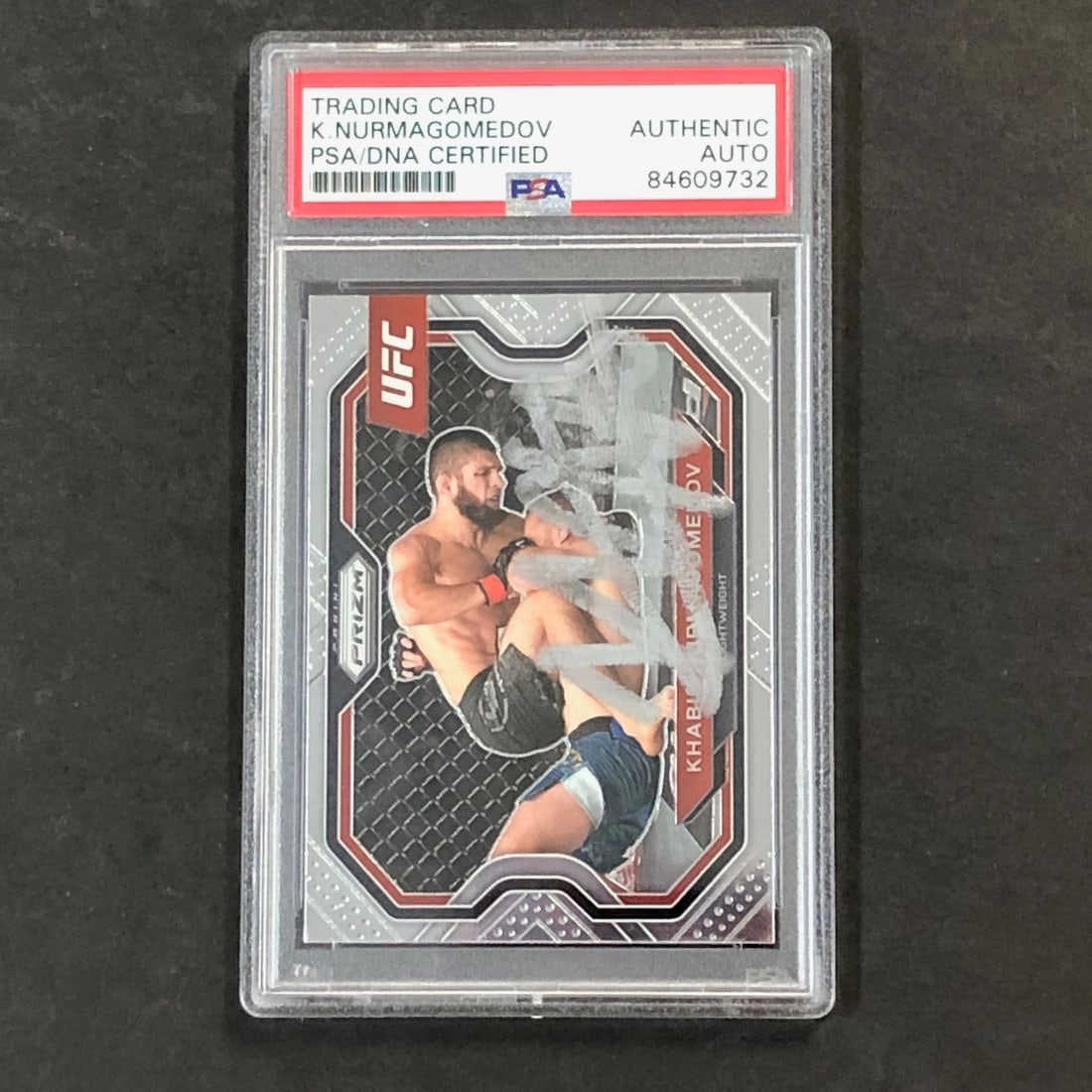 2021 Khabib Nurmagomedov Signed Panini Prizm UFC #181 Card PSA Authenticated: 2021 Khabib Nurmagomedov Signed Panini Prizm UFC #181 Card PSA Authenticated This collectible trading card features Khabib Nurmagomedov, a prominent figure in Mixed Martial Arts (MMA), and is part of 