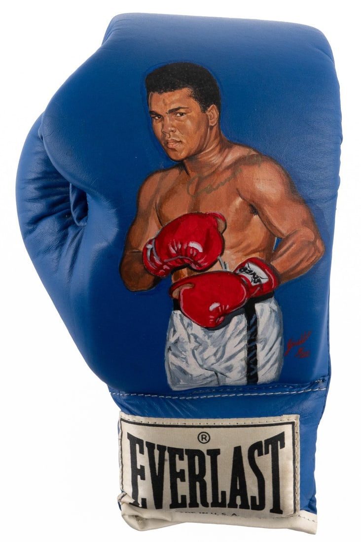 Everlast hand painted boxing glove signed by Muhammad Ali JSA: Everlast hand painted boxing glove signed by Muhammad Ali JSA This limited-edition Everlast boxing glove features a hand-painted portrait of Muhammad Ali, also known as Cassius Clay, in a boxing pose.