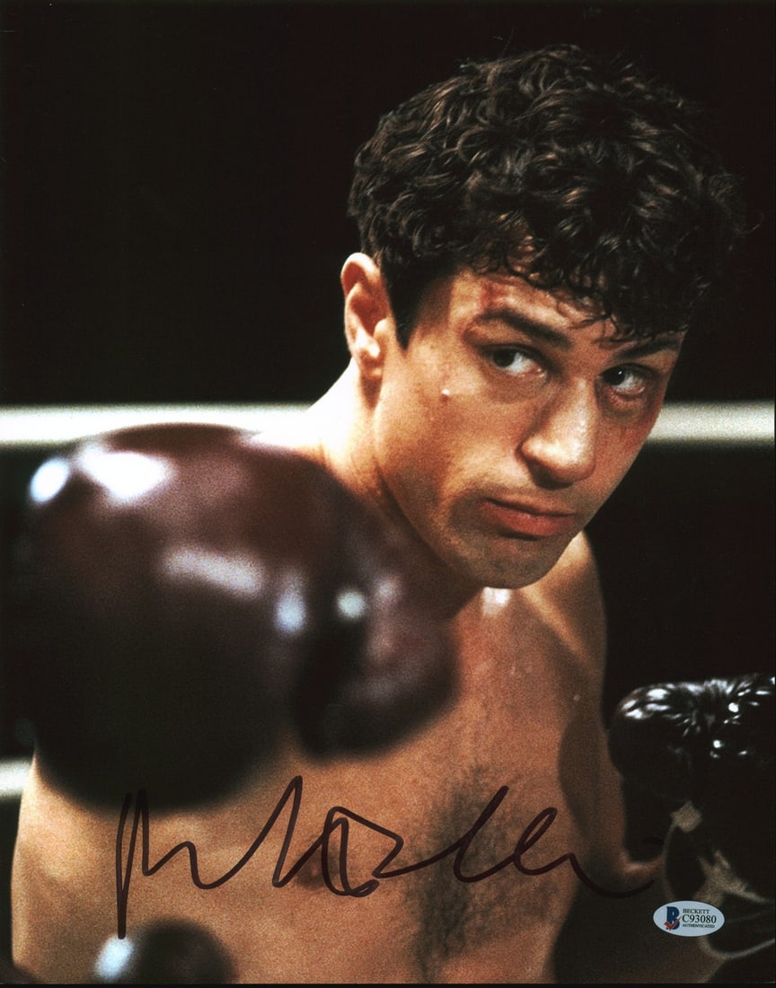 Robert De Niro Raging Bull Signed 11x14 Photo Beckett Authenticated: Robert De Niro Raging Bull Signed 11x14 Photo Beckett Authenticated This authentic 11x14 photograph is personally signed by Robert De Niro from the iconic film 'Raging Bull.' The signature is verified