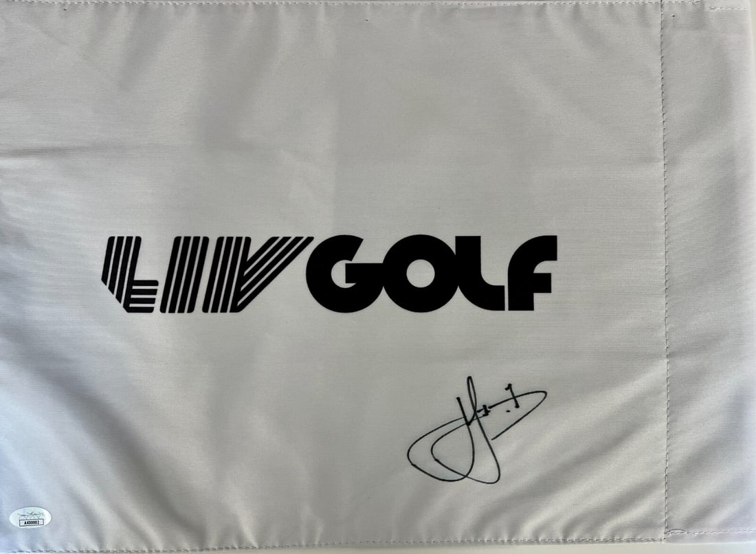 Cam Smith Signed LIV Golf Pin Flag JSA Authenticated AK00002: Cam Smith Signed LIV Golf Pin Flag JSA Authenticated AK00002 This is an officially licensed LIV Golf pin flag, prominently signed by the golf superstar Cam Smith. The item has been authenticated by Ja