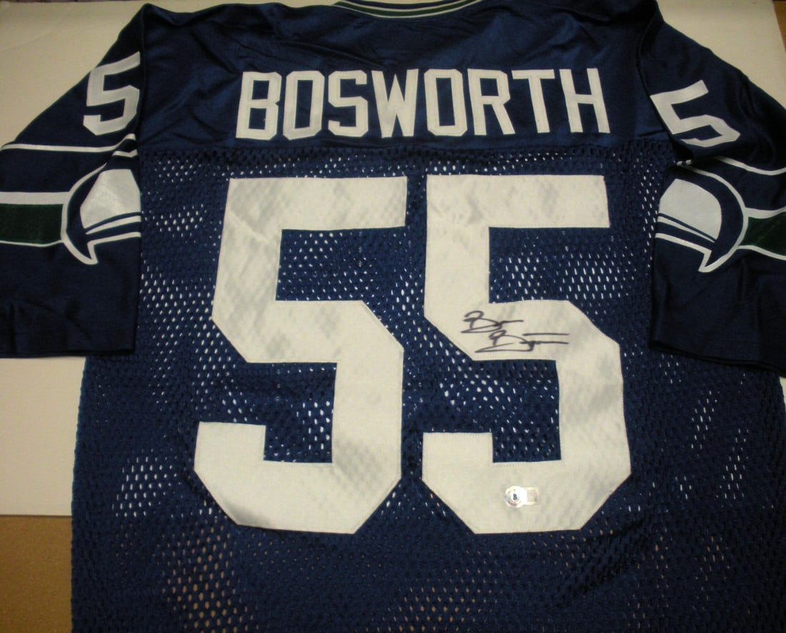Brian Bosworth Seahawks Signed Sand Knit NFL Jersey Beckett COA: Brian Bosworth Seahawks Signed Sand Knit NFL Jersey Beckett COA This is an officially licensed Sand Knit Seattle Seahawks jersey signed by Brian Bosworth. The jersey comes with Beckett Certificate of 