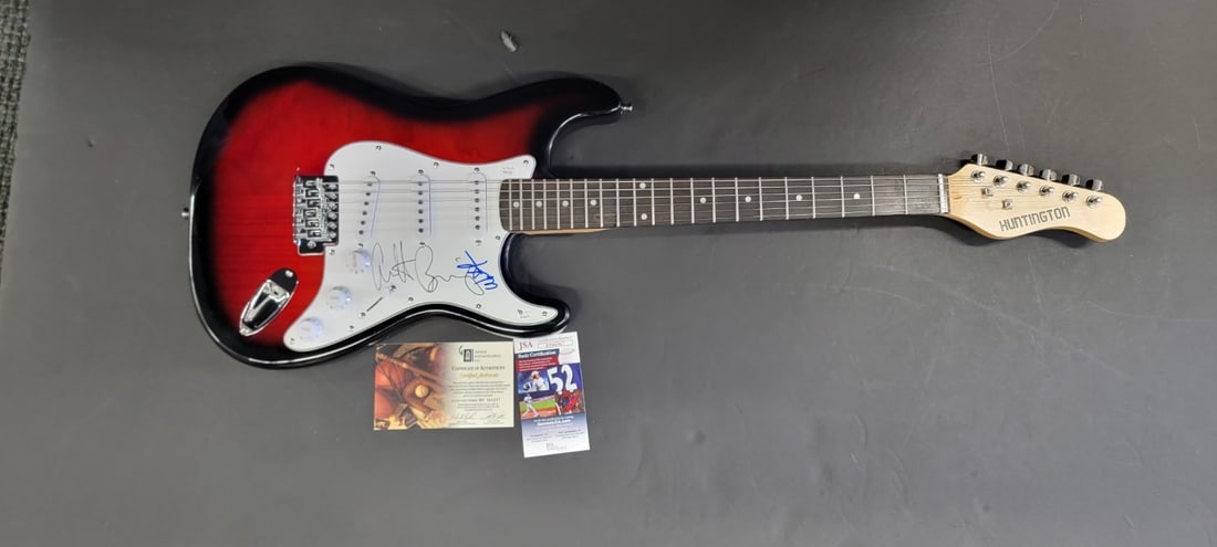 Autographed Electric Guitar Warren Beatty Annette Bening JSA: Autographed Electric Guitar Warren Beatty Annette Bening JSA This electric guitar and guitar pick have been hand-signed by Warren Beatty and Annette Bening. The autographs are authenticated by James S