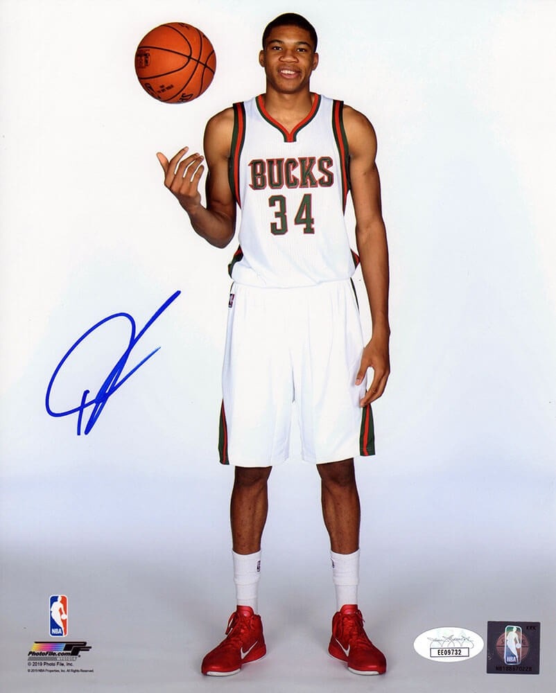 8x10 Autographed Photo of Giannis Antetokounmpo in Bucks White Jersey JSA: 8x10 Autographed Photo of Giannis Antetokounmpo in Bucks White Jersey JSA This is an original 8x10 photo featuring Giannis Antetokounmpo in a Milwaukee Bucks white jersey standing with a basketball po