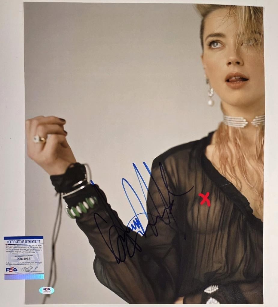 Amber Heard autographed 16x20 photograph PSA COA: Amber Heard autographed 16x20 photograph PSA COA This is an original 16x20 photograph signed by Amber Heard. The autograph has been authenticated by PSA/DNA, ensuring its authenticity. The photograph 