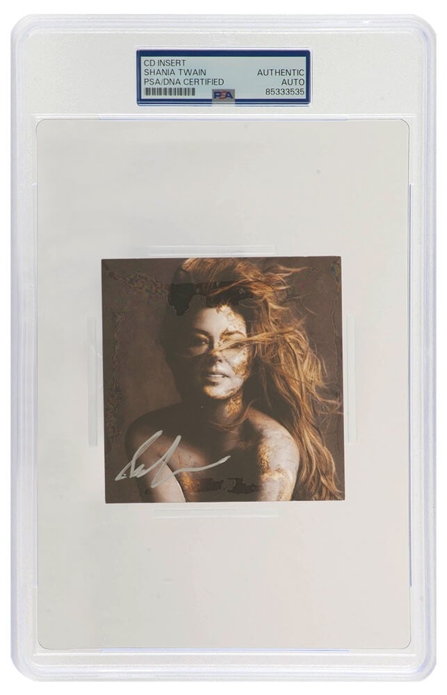 Shania Twain Signed Queen Of Me CD Insert PSA/DNA Encapsulated: Shania Twain Signed Queen Of Me CD Insert PSA/DNA Encapsulated This item features a signed 4x4 CD insert of Shania Twain's 'Queen Of Me'. The insert is encapsulated by PSA/DNA, ensuring its authentici