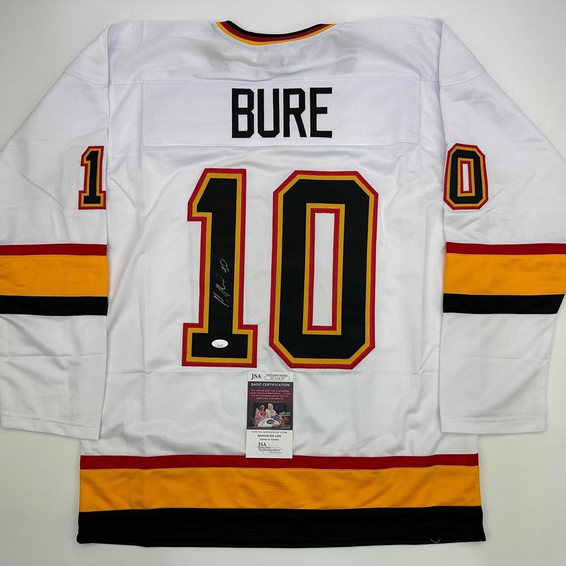 Pavel Bure Autographed Vancouver Canucks Jersey with JSA COA: Pavel Bure Autographed Vancouver Canucks Jersey with JSA COA Own a piece of hockey history with this autographed Pavel Bure Vancouver White Hockey Jersey. This authentic collectible features the signa