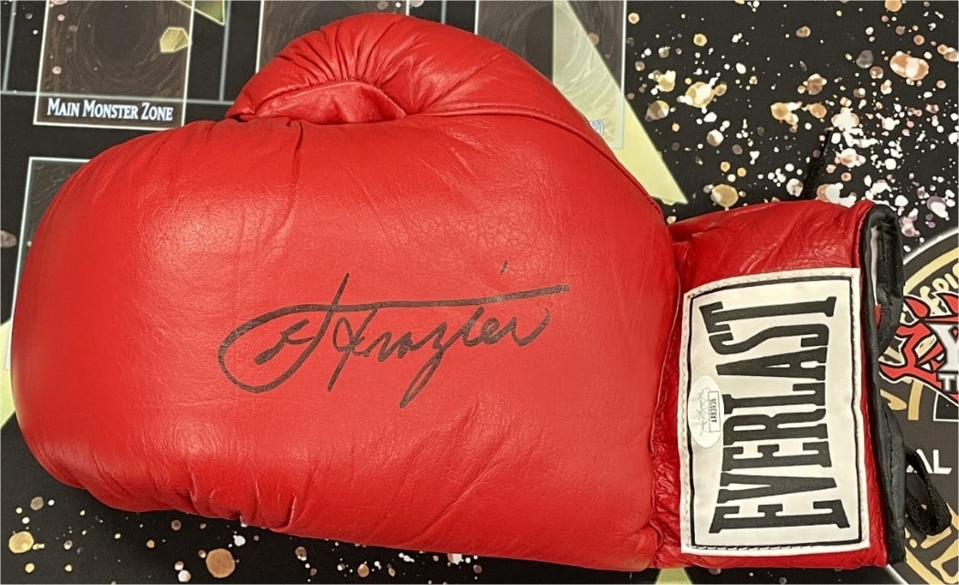 JSA Certified Everest Boxing Glove Signed by Smokin Joe Frazier: JSA Certified Everest Boxing Glove Signed by Smokin Joe Frazier Original Everest boxing glove signed by "Smokin" Joe Frazier in black ink. This pre-owned Hall of Famer collectible includes JSA authent