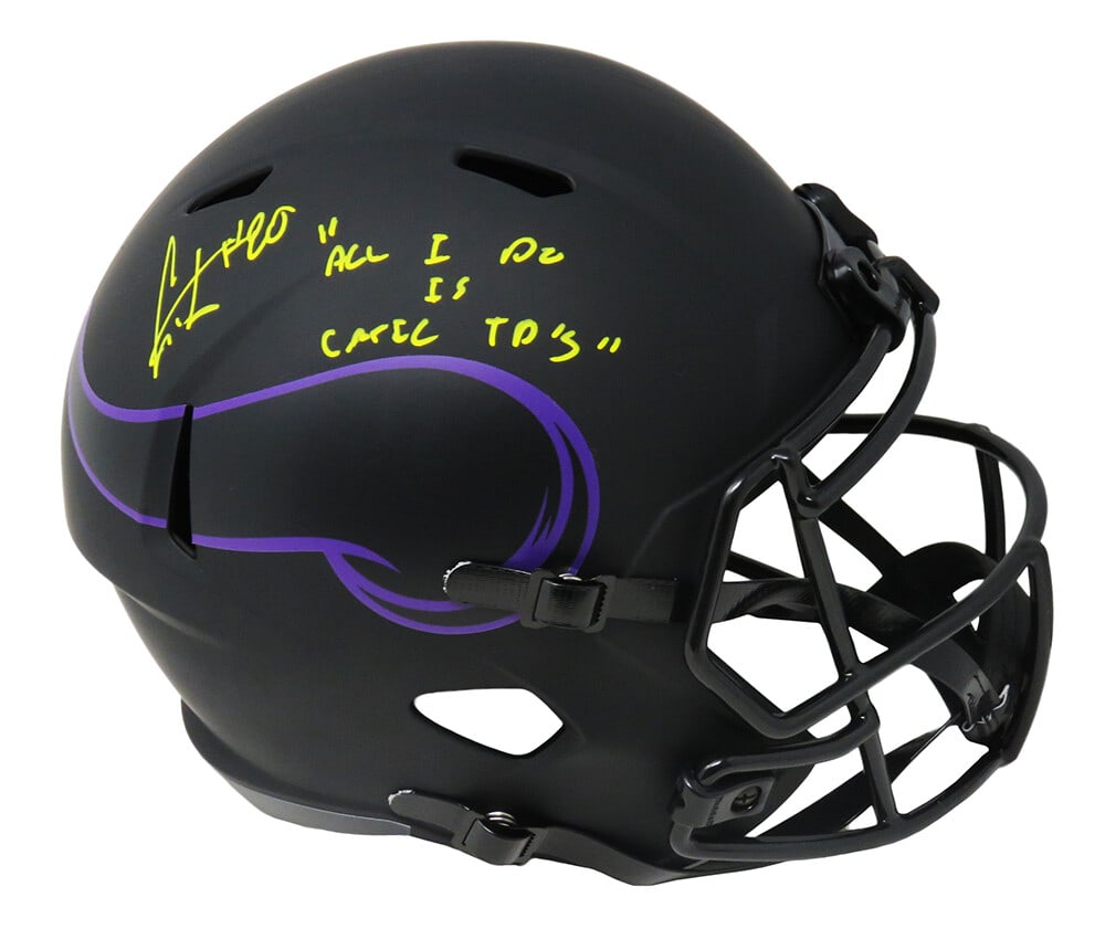 Cris Carter Signed Vikings Eclipse Replica Helmet with Inscription: Cris Carter Signed Vikings Eclipse Replica Helmet with Inscription This full-size replica helmet features a striking black matte finish and is signed by Cris Carter, the iconic wide receiver known for