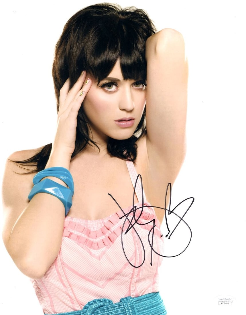 Katy Perry 11x14 Autographed Photo Pink Top JSA Certified: Katy Perry 11x14 Autographed Photo Pink Top JSA Certified This stunning 11x14 photograph features the vibrant Katy Perry in a sexy pink top, capturing her iconic presence. The photo is authenticated b