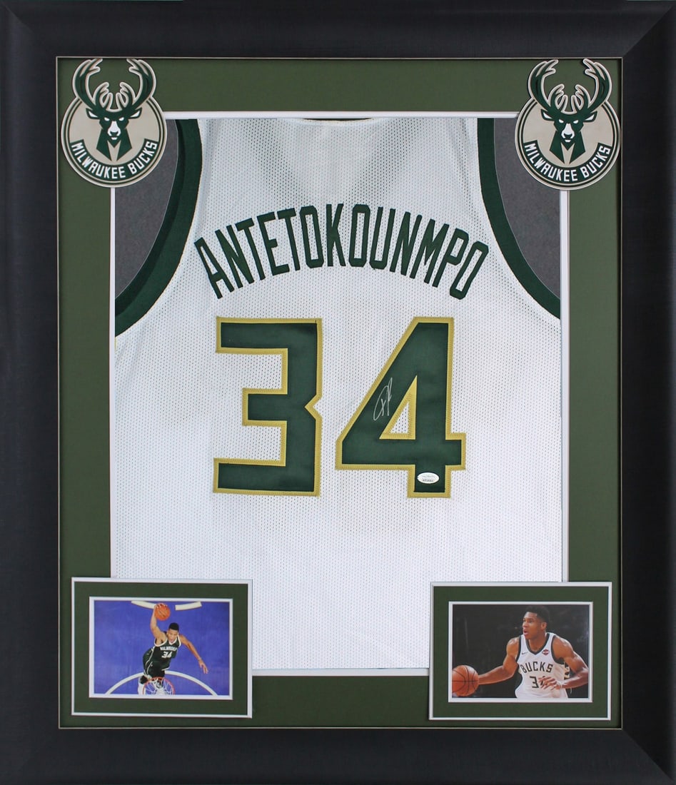 Framed White Pro Style Jersey Signed by Giannis Antetokounmpo JSA: Framed White Pro Style Jersey Signed by Giannis Antetokounmpo JSA This autographed white pro style framed jersey has been personally signed by Giannis Antetokounmpo of the Milwaukee Bucks. It is an or