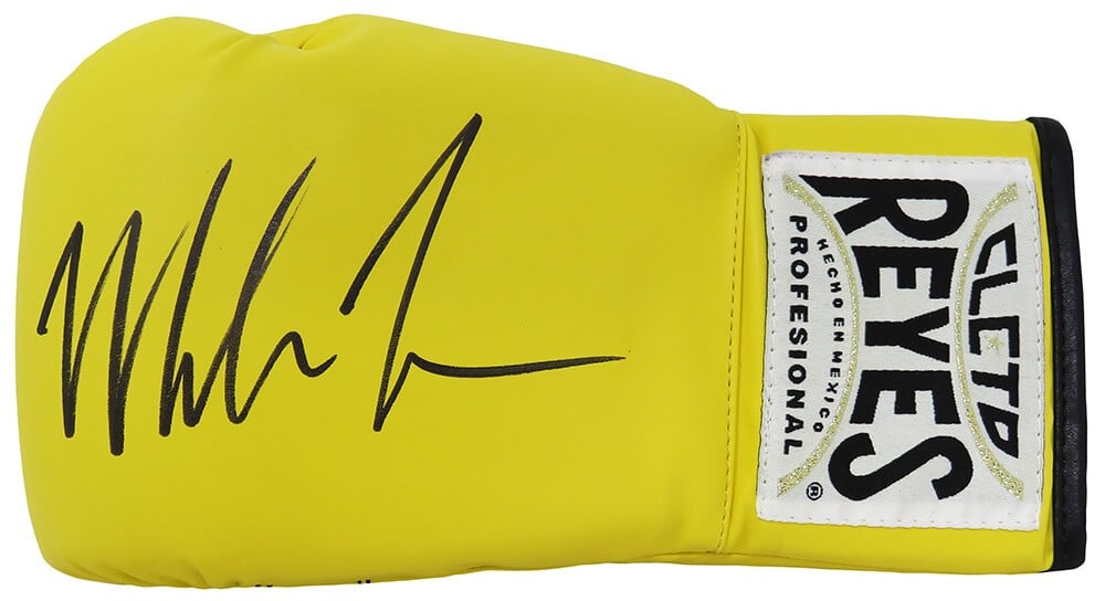 Mike Tyson Autographed Cleto Reyes Yellow Boxing Glove with COA: Mike Tyson Autographed Cleto Reyes Yellow Boxing Glove with COA This is an original Mike Tyson signed Cleto Reyes yellow boxing glove, an iconic piece for boxing fans and collectors alike. The glove f