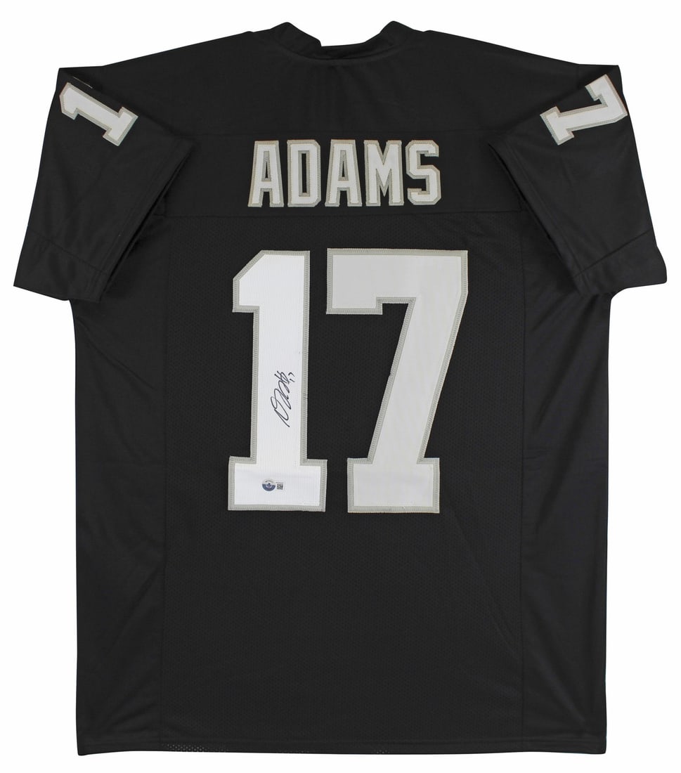 Davante Adams Signed Black Pro Jersey with White Numbers BAS Witnessed: Davante Adams Signed Black Pro Jersey with White Numbers BAS Witnessed This authentic black pro style jersey, featuring white numbers, has been personally signed by Davante Adams of the Las Vegas Raid