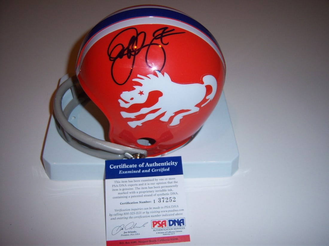 Signed Mini Helmet Authenticated by PSA DNA Featuring John Elway: Signed Mini Helmet Authenticated by PSA DNA Featuring John Elway This authentic original mini helmet features signatures from John Elway, associated with the Denver Broncos and Stanford. The item is a