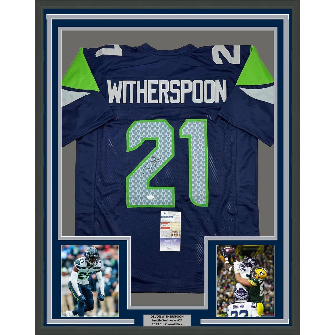 Seattle Seahawks Devon Witherspoon Signed Framed Blue Jersey JSA 35x39: Seattle Seahawks Devon Witherspoon Signed Framed Blue Jersey JSA 35x39 Professionally framed and matted Seattle blue autographed jersey signed by Devon Witherspoon. This pre-owned display includes two