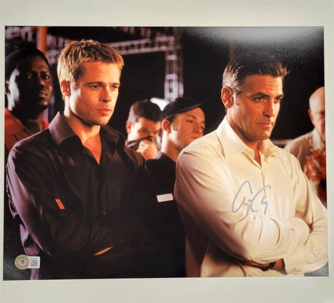 George Clooney Signed Ocean's Eleven 11x14 Autographed Photo Beckett Authenticated: George Clooney Signed Ocean's Eleven 11x14 Autographed Photo Beckett Authenticated This is an original 11x14 photograph from the iconic movie Ocean's Eleven, personally signed by acclaimed actor Georg