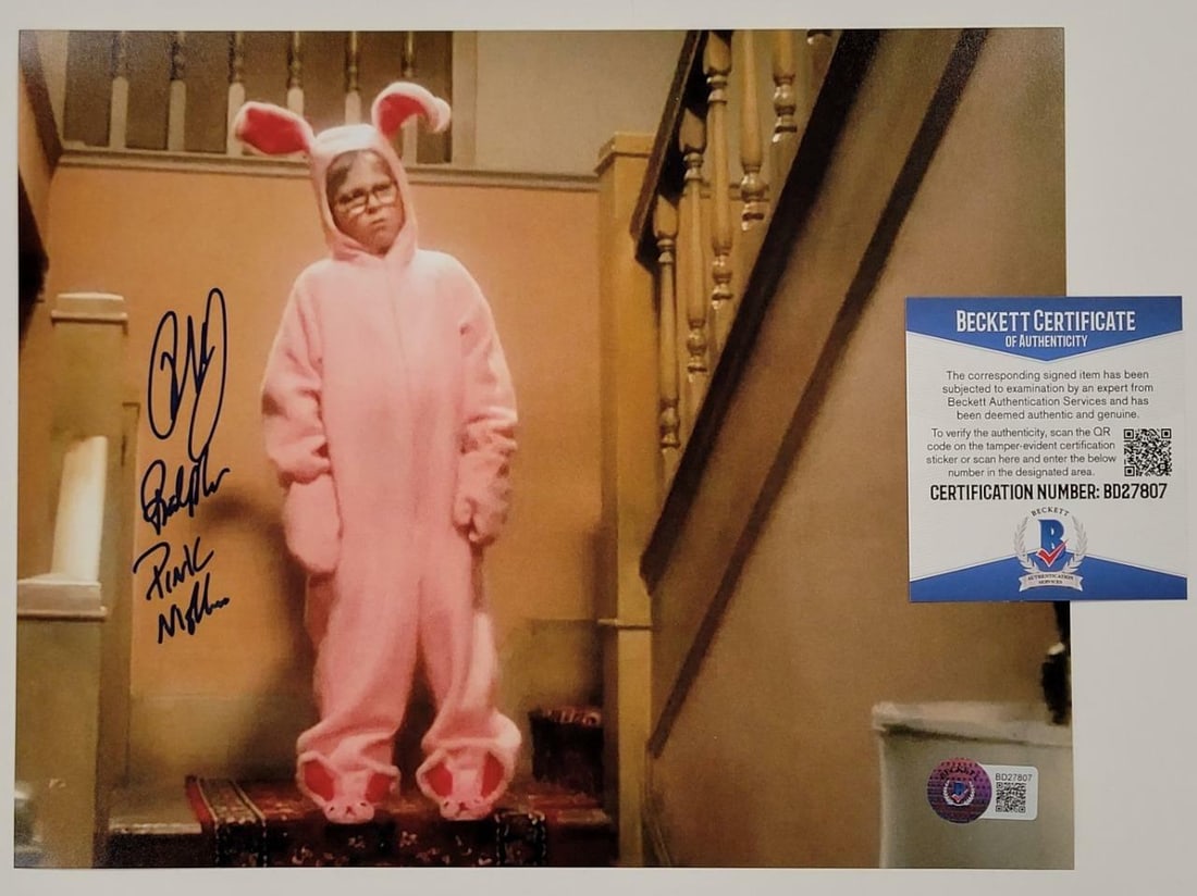 Signed 8x10 Photo of Peter Billingsley Pink Nightmare Scene With BAS COA: Signed 8x10 Photo of Peter Billingsley Pink Nightmare Scene With BAS COA This is an original 8x10 photograph from the film "A Christmas Story," featuring the "Pink Nightmare" scene. The photo is hand-