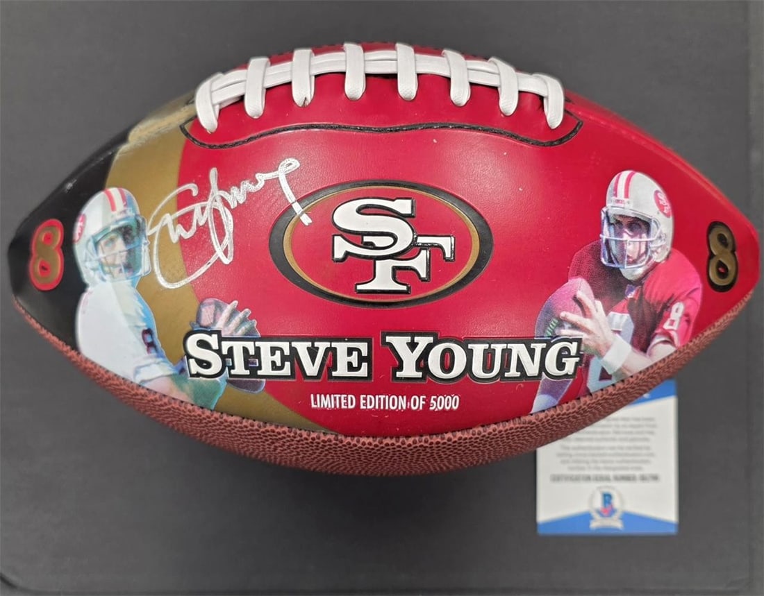San Francisco 49ers Football Signed by Steve Young Beckett Authenticated: San Francisco 49ers Football Signed by Steve Young Beckett Authenticated This limited edition NFL football features the autograph of Steve Young and highlights his career statistics. The ball is authe