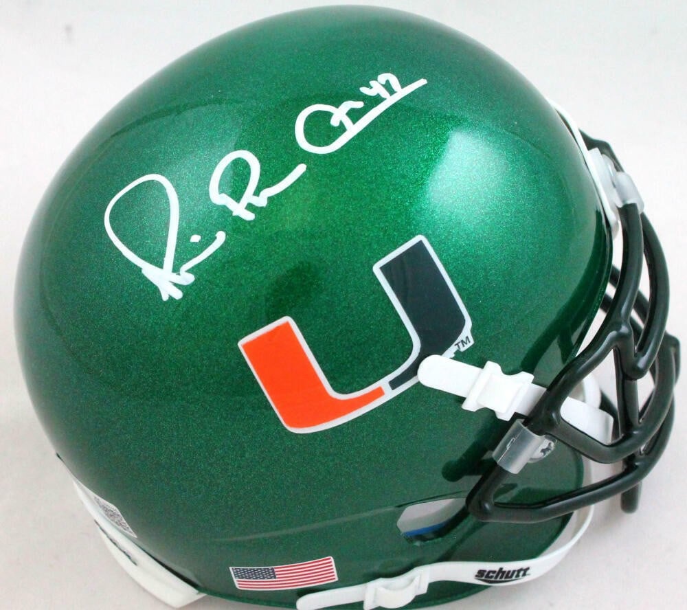 Schutt Mini Helmet Miami Hurricanes Michael Irvin Signed Beckett Hologram: Schutt Mini Helmet Miami Hurricanes Michael Irvin Signed Beckett Hologram This is an original Miami Hurricanes football mini helmet signed by Michael Irvin. It is a green Schutt mini helmet and comes 