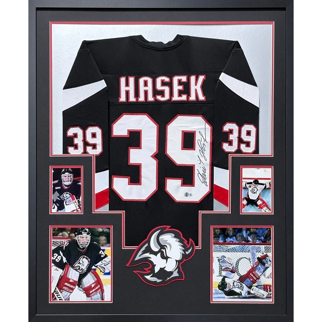 Framed Buffalo Sabres Dominik Hasek Autographed Black Jersey JSA: Framed Buffalo Sabres Dominik Hasek Autographed Black Jersey JSA Framed Buffalo Sabres black jersey autographed by Dominik Hasek. Professionally presented with detailed framing and logo display, this 
