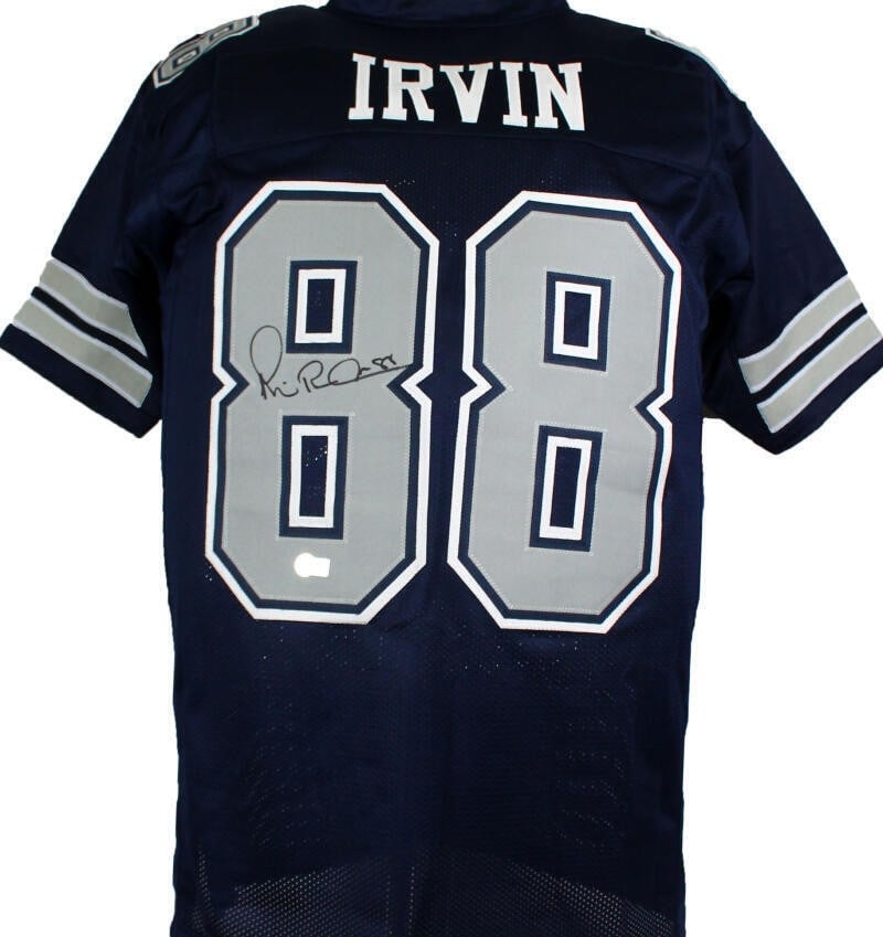 Dallas Cowboys Michael Irvin Signed Pro Style Jersey Beckett Hologram: Dallas Cowboys Michael Irvin Signed Pro Style Jersey Beckett Hologram Autographed Michael Irvin pro style football jersey in blue and grey, associated with the Dallas Cowboys. The item is listed as or
