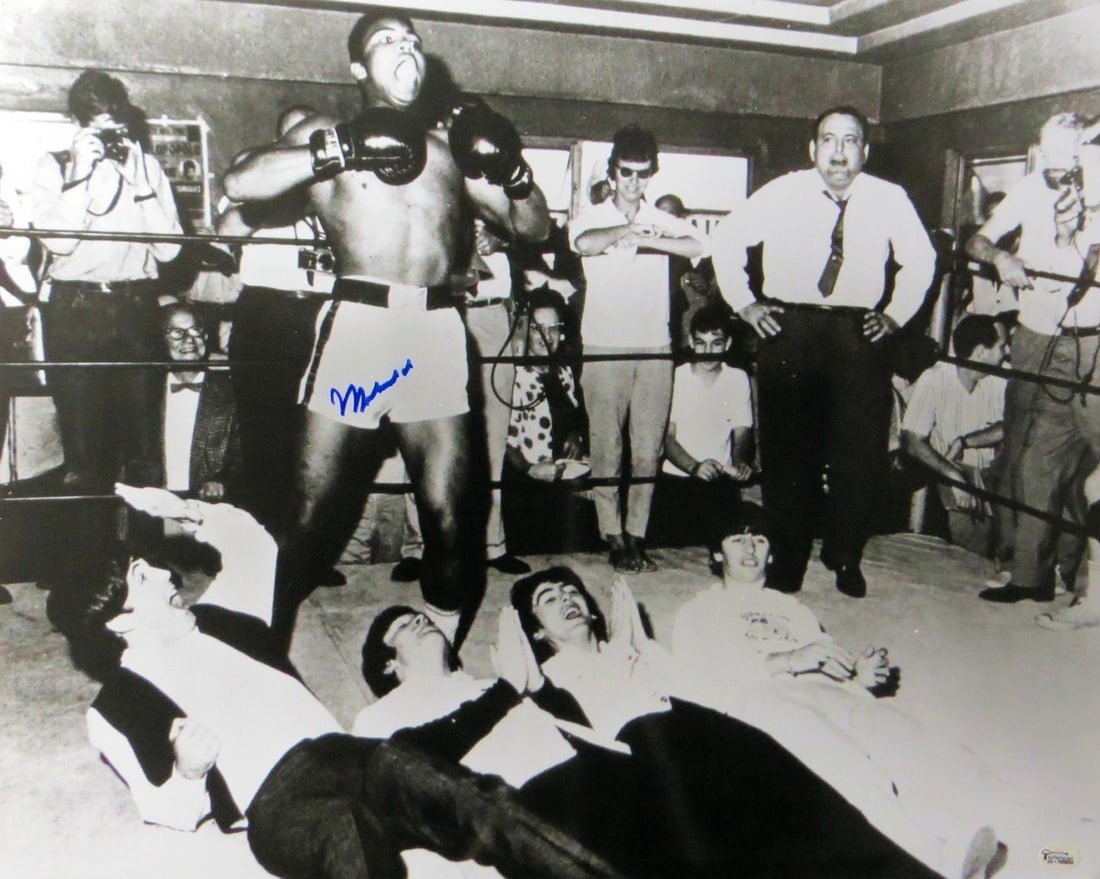 Muhammad Ali Autographed 16X20 Photo with The Beatles Online Authentics: Muhammad Ali Autographed 16X20 Photo with The Beatles Online Authentics This remarkable 16X20 photo features Muhammad Ali, one of the greatest boxers in history, and is autographed by him, making it a
