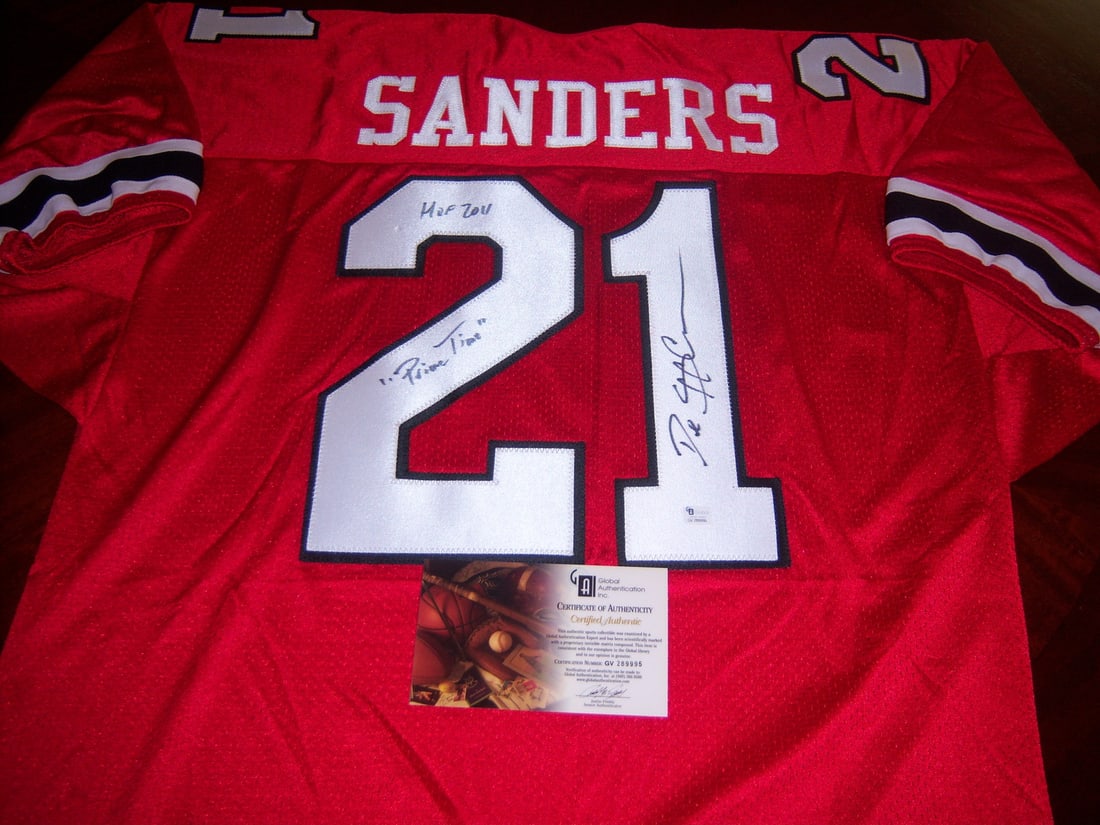Signed Deion Sanders Atlanta Falcons Jersey HOF 2011 With GAI COA: Signed Deion Sanders Atlanta Falcons Jersey HOF 2011 With GAI COA This is a pre-owned Atlanta Falcons red jersey signed by Deion Sanders. The jersey is an original item and commemorates his Hall of Fa